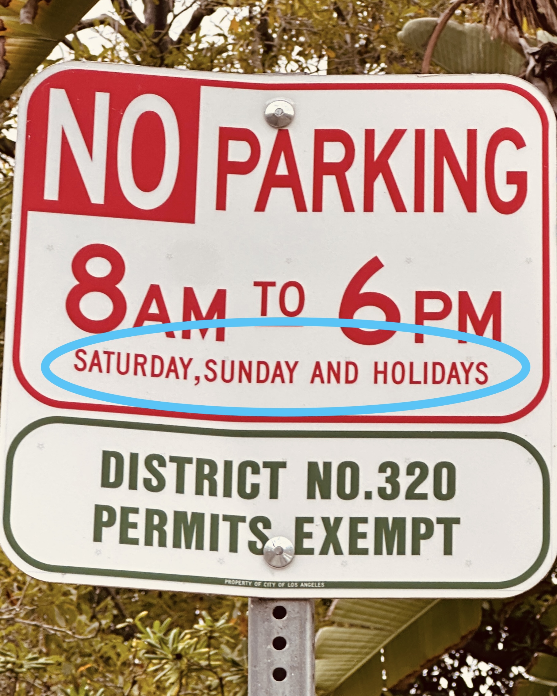Hollywoodland parking sign showing no parking Saturday, Sunday, and holidays, with District 320 permits exempt.